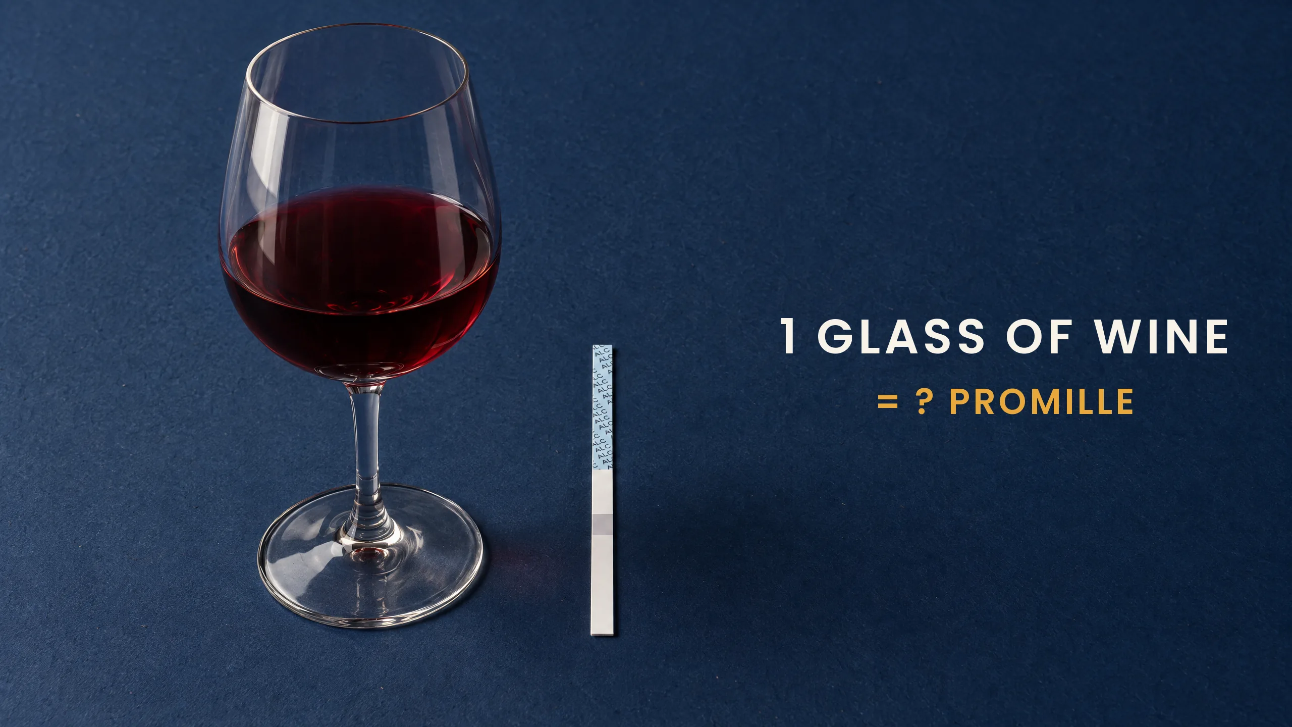 A glass of red wine next to an AlkoSafe saliva screening strip: how much promille is a glass of wine?
